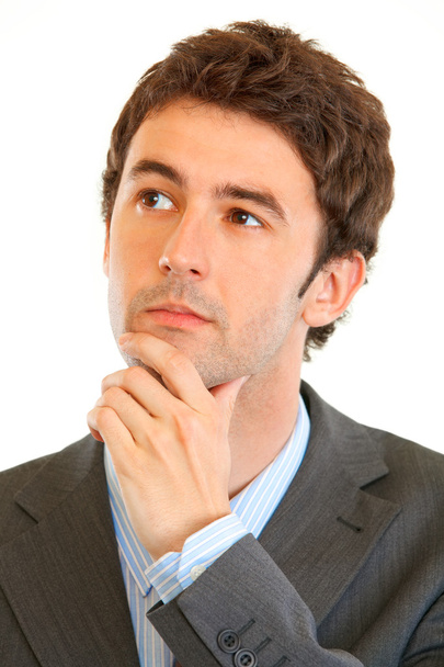 Portrait of serious modern businessman looking in corner at copy space - Photo, image