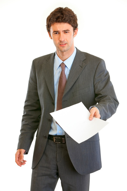 Displeased modern businessman showing document - Zdjęcie, obraz