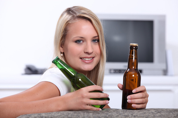 Teenage girl with beer bottles - Fotoğraf, Görsel