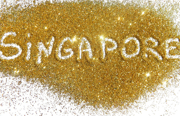 Inscription Singapour sur paillettes dorées scintille sur fond blanc
 - Photo, image