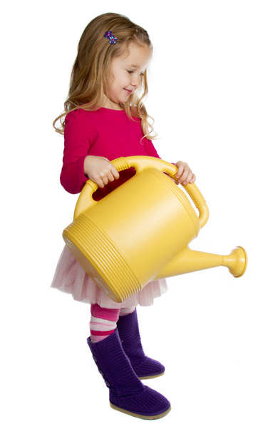 Small Child using watering can - Фото, изображение