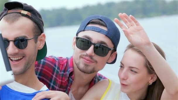 Beautiful and smiling three friends make photographing and selfie - Footage, Video