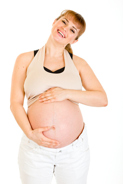Happy beautiful pregnant woman touching her belly isolated on white - Photo, image