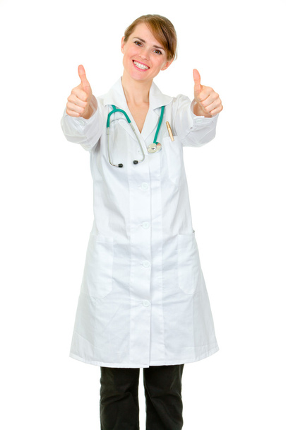 Smiling medical doctor woman showing thumbs up gesture - Φωτογραφία, εικόνα