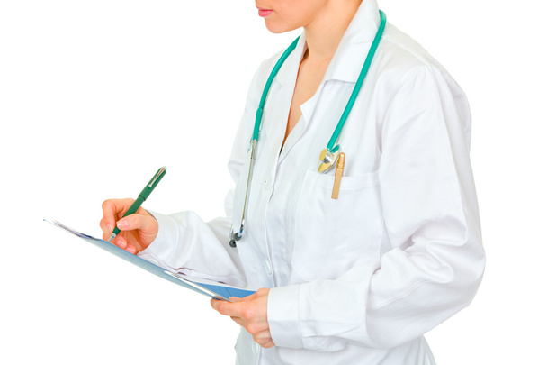 Medical female doctor making notes in document. Close-up. - Foto, Imagem