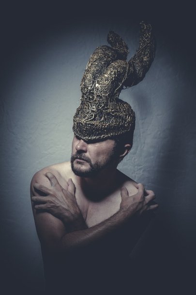 Naked man with helmet warrior trumpets - Fotó, kép