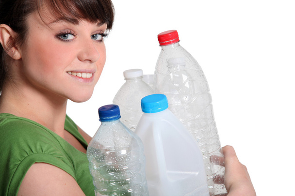 Young woman recycling plastic - Foto, imagen