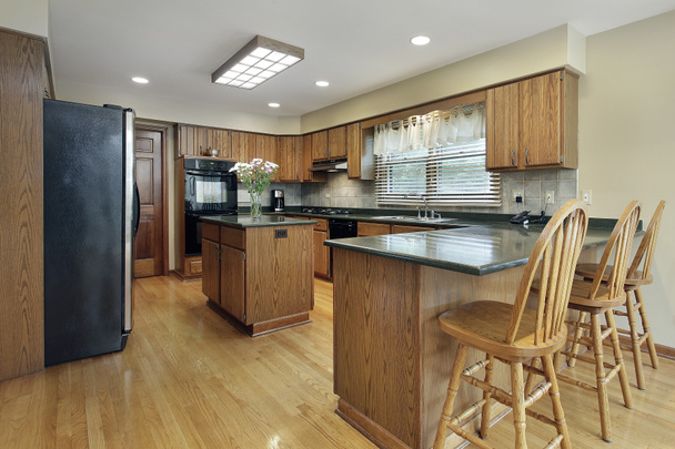 Kitchen with wood cabinetry - Photo, Image