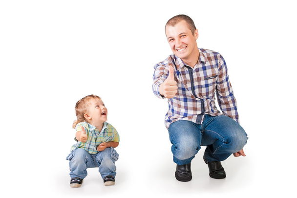 Happy father and son with thumbs up isolated on white - 写真・画像