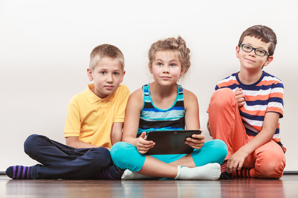 Children playing on tablet - Foto, Imagen