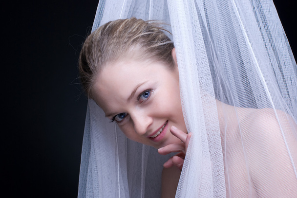Closeup portrait of beautiful blond girl in white fabric - Foto, Imagem