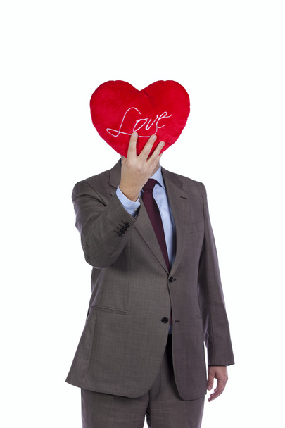 Businessman with love heart face - Фото, изображение