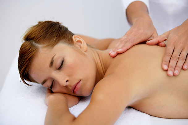 Woman having a soothing back massage - Foto, imagen