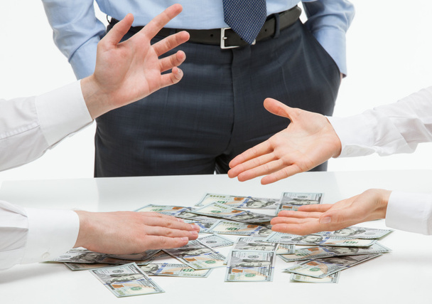 Business people sharing money - Фото, изображение