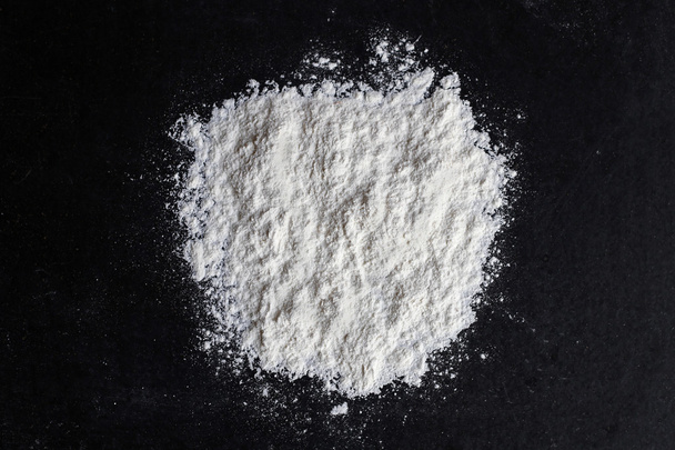 Spilled White Baking Flour on Black Background - Photo, Image