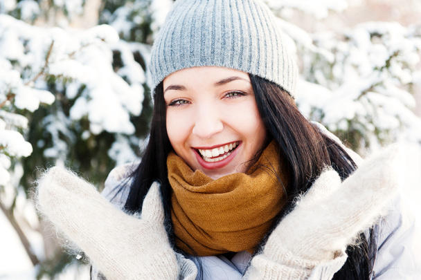 Portrait of young beautiful girl outdoors in winter having fun a - Foto, Imagen