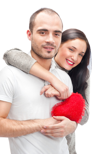 Happy young adult couple with red heart on white background, emb - Valokuva, kuva