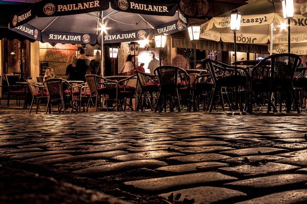 KRAKOW, POLAND - SEPTEMBER 18, 2015: People are resting in cafe - Photo, image