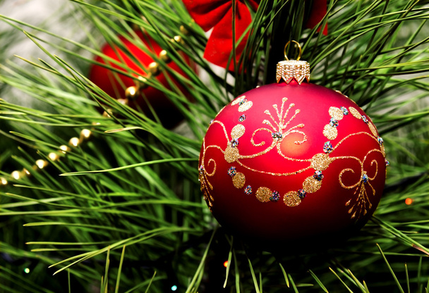 Christmas ball hanging on fir tree - Фото, зображення