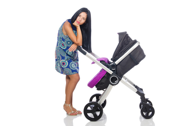 Glückliche Mutter mit ihrem Baby im Kinderwagen - Foto, Bild