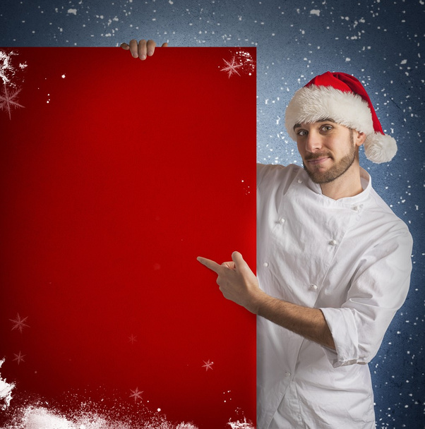 Chef muestra una cartelera roja
 - Foto, imagen