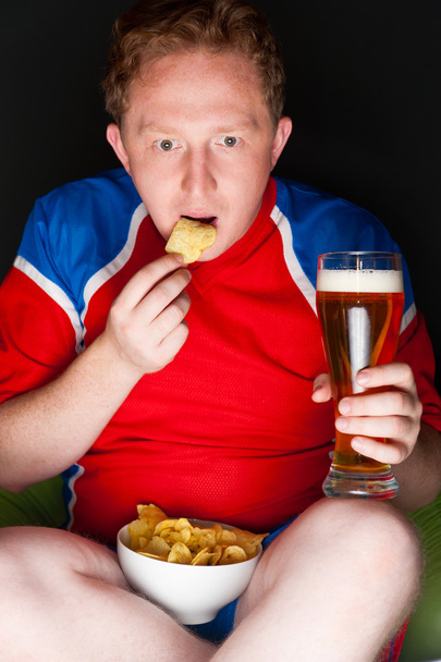 Closeup portrait of young man wearing sportswear fan of football - Foto, imagen