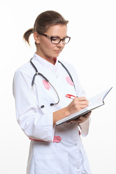 Portrait of a friendly female doctor with folder - Φωτογραφία, εικόνα