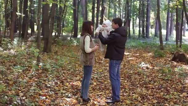 Family with child go in autumn park - Footage, Video