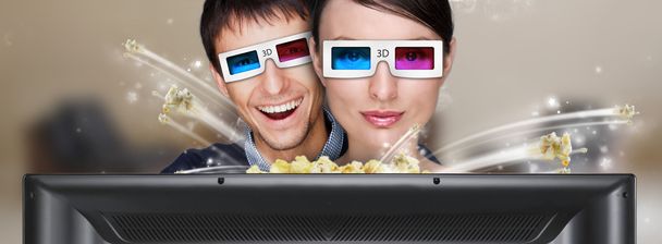 Portrait of young stylish modern couple wearing 3d glasses watch - Photo, Image