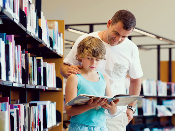 Boy and his father in library - Foto, Imagem