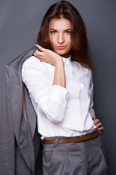 Portrait of a beautiful young business woman standing with hand - Фото, изображение