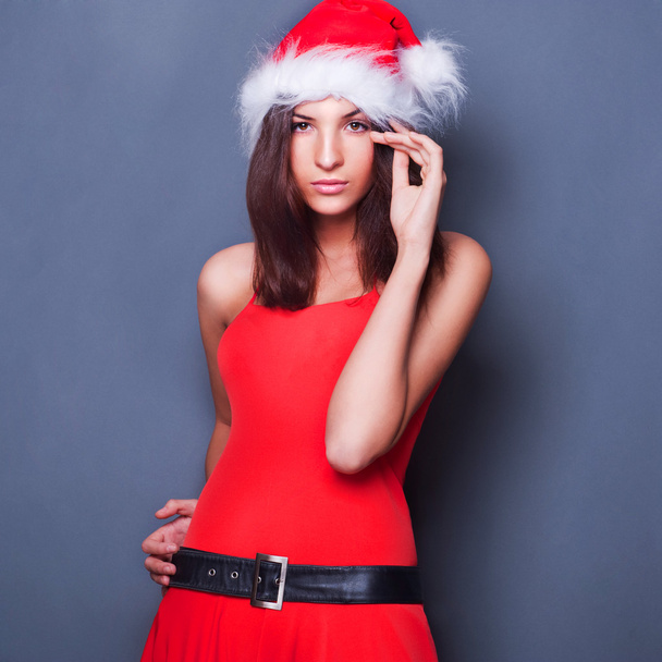 20-25 years od beautiful woman in christmas dress posing against - Photo, Image