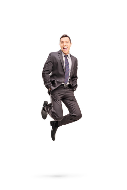 Joyful businessman jumping out of happiness - Foto, afbeelding