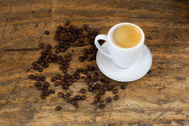 xícara de café e feijão na mesa - Foto, Imagem