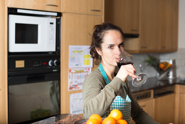 Woman drinking a glass of wine - Photo, Image