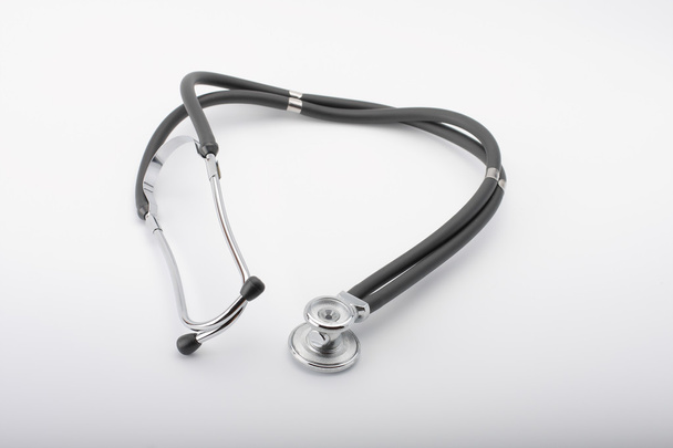 Black stethoscope on white background, close up view. - Foto, imagen