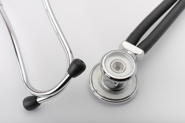 Black stethoscope on white background, close up view. - Photo, Image