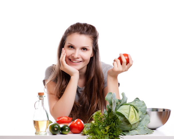 Young Woman Cooking in the kitchen. Healthy Food - Vegetable Salad. Diet. Dieting Concept. Healthy Lifestyle. Cooking At Home. - Foto, Bild