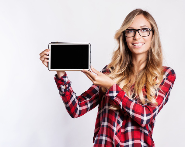 Smiling woman with tablet computer - 写真・画像