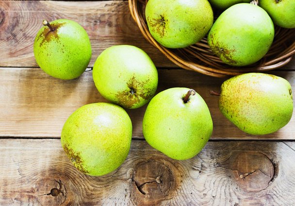 Fresh organic pears on old wood. Pear autumn harvest - Fotó, kép