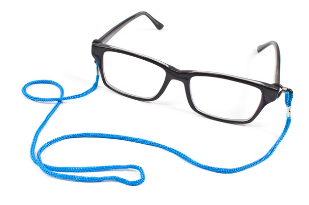Brillen met blauwe tape geïsoleerd op wit - Foto, afbeelding