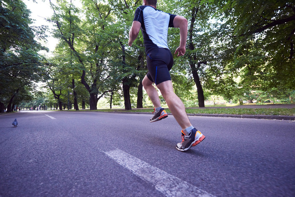 jogging man on empty  road - Foto, afbeelding