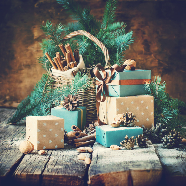 Christmas Card. Gifts with Boxes, Basket, Pine Cones, Walnutsd. Toned - Zdjęcie, obraz