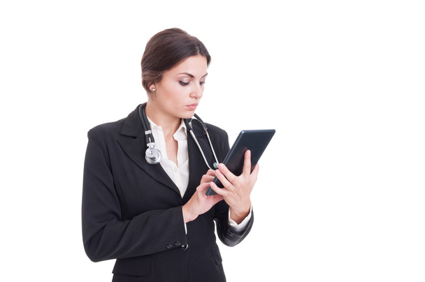 Young and modern woman doctor using wireless tablet pc - Фото, изображение