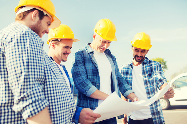 group of builders with tablet pc and blueprint - Φωτογραφία, εικόνα
