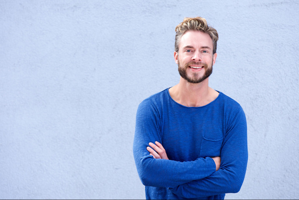 Confident guy smiling with arms crossed - Photo, Image