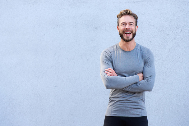 Fitness trainer laughing with arms crossed - Fotoğraf, Görsel