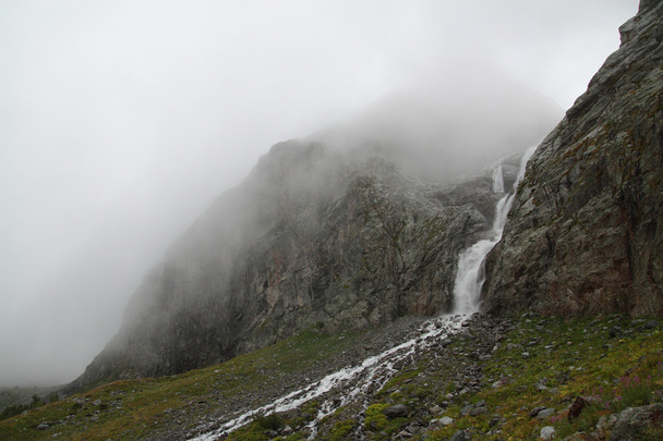 Waterfall in the fog - Фото, изображение