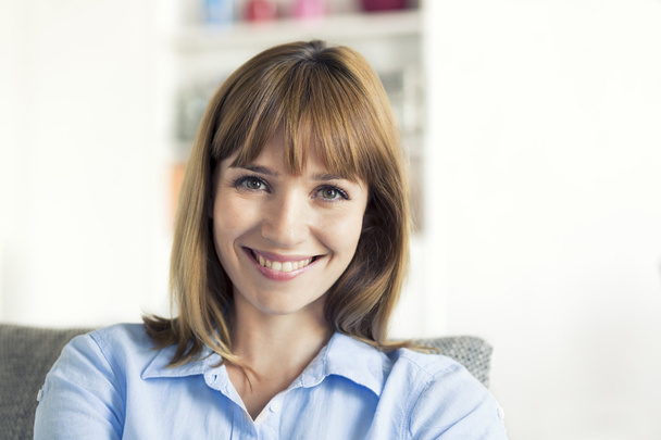 woman smiling  in modern home - Photo, image