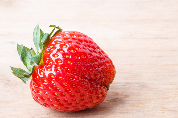 Red fresh strawberry fruit on wooden table. - Foto, Imagem